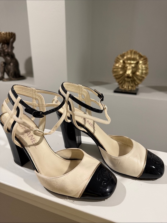 CHANEL Shoes - CHANEL Ivory Leather Heels with Black Patent Toe Cap